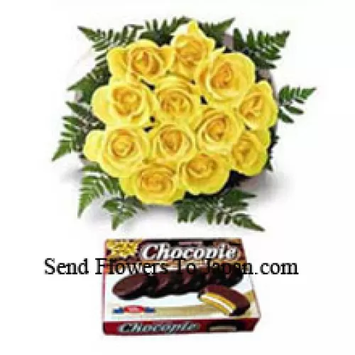 Bündel von 11 gelben Rosen und einer Schachtel Schokolade